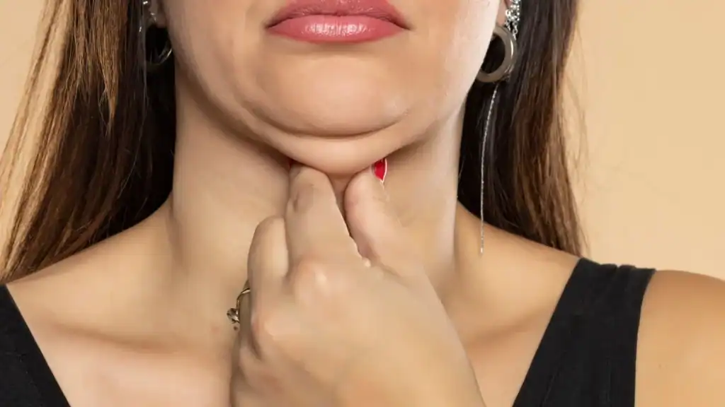 An image of a woman with double chin, sad, worried : Non Surgical Double Chin Removal Treatment in Elgin, UK